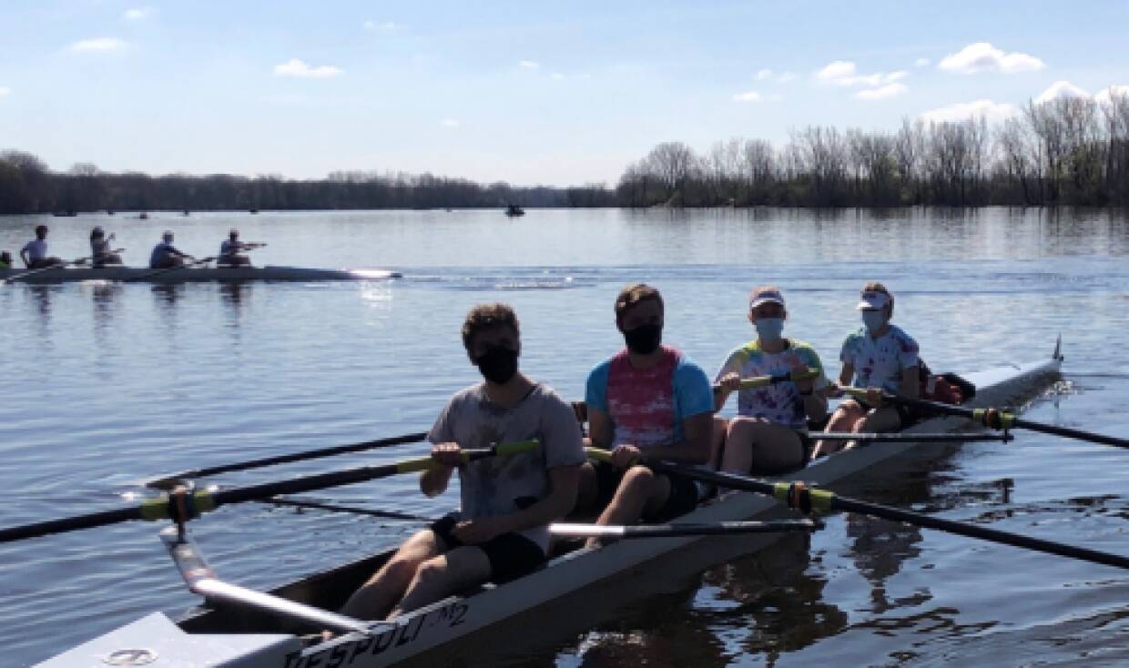 Rowing athlete compete in boats of 4 on Grand River during inter-squad scrimmage.